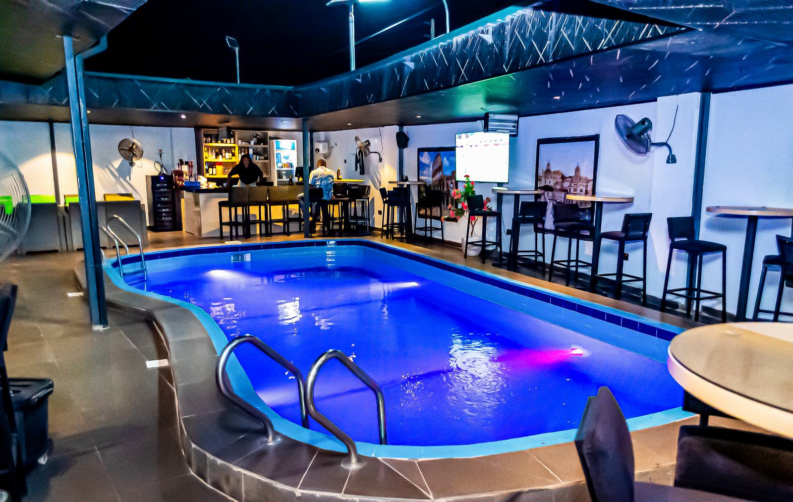 Arena Continental pool illuminated at night