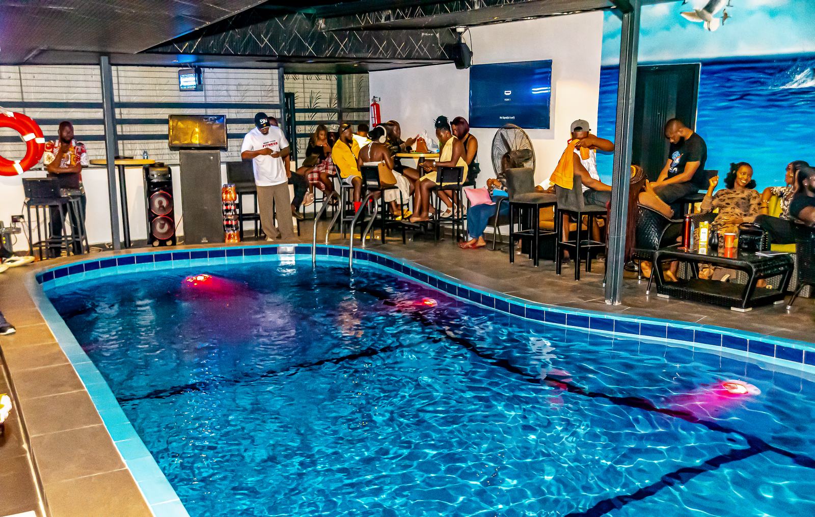 Guests enjoying a poolside evening at Arena Continental